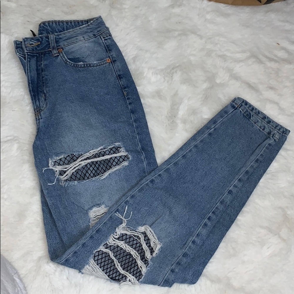 Ripped fishnet jeans